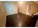 Large bedroom with hardwood floors, neutral paint, and multiple closets at 2961 River Ridge Drive Sw, Atlanta, GA 30354
