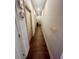 Hallway featuring hardwood floors and neutral paint, with doorways leading to various rooms at 2961 River Ridge Drive Sw, Atlanta, GA 30354