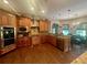 Gourmet kitchen featuring custom wood cabinetry, granite countertops, stainless steel appliances, and hardwood flooring at 2961 River Ridge Drive Sw, Atlanta, GA 30354
