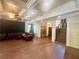 Spacious living room featuring hardwood floors, coffered ceilings, and a cozy seating area with a Christmas tree at 2961 River Ridge Drive Sw, Atlanta, GA 30354