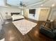 Spacious main bedroom with TV, trey ceilings, sitting area, and hardwood floors at 2961 River Ridge Drive Sw, Atlanta, GA 30354