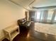 Spacious main bedroom with hardwood floors, sitting area, and coffered ceilings at 2961 River Ridge Drive Sw, Atlanta, GA 30354