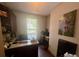 Home office featuring a built-in desk, ample storage, and bright natural light at 2961 River Ridge Drive Sw, Atlanta, GA 30354