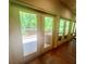 Sunroom featuring many windows and door leading to an outdoor deck area at 2961 River Ridge Drive Sw, Atlanta, GA 30354