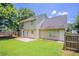 The backyard has a spacious lawn and patio, perfect for outdoor relaxation at 1797 Emerson Lake Cir, Snellville, GA 30078