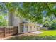 The backyard has a spacious lawn and patio, with a fenced in yard and mature trees at 1797 Emerson Lake Cir, Snellville, GA 30078