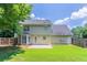 The backyard has a spacious lawn and patio, with a fenced in yard at 1797 Emerson Lake Cir, Snellville, GA 30078