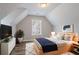 Cozy bedroom featuring neutral colors, wood floors, and a comfortable bed at 1797 Emerson Lake Cir, Snellville, GA 30078