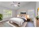 Serene bedroom with a plush bed, neutral colors, and ample natural light at 1797 Emerson Lake Cir, Snellville, GA 30078