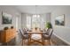 Bright dining room with a large bay window and stylish decor at 1797 Emerson Lake Cir, Snellville, GA 30078