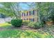 Brick home with black shutters and professional landscaping at 1797 Emerson Lake Cir, Snellville, GA 30078