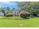 Well-maintained two-story home with a lush green lawn and mature landscaping at 1797 Emerson Lake Cir, Snellville, GA 30078