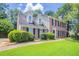Traditional brick home with dormers and mature landscaping at 1797 Emerson Lake Cir, Snellville, GA 30078