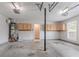 A two car garage with concrete floors, built-in cabinets and water heater at 1797 Emerson Lake Cir, Snellville, GA 30078