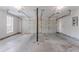 A two car garage with concrete floors and two garage doors, a useful space at 1797 Emerson Lake Cir, Snellville, GA 30078