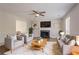 Inviting living room with a fireplace, plush seating, and modern decor at 1797 Emerson Lake Cir, Snellville, GA 30078