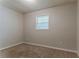 Comfortable bedroom with neutral carpeting and natural light at 2783 Bicentennial Dr, Stone Mountain, GA 30087