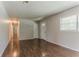 Bright living room features updated flooring and a front-facing window at 2783 Bicentennial Dr, Stone Mountain, GA 30087