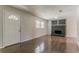 Spacious living room with modern floors, a fireplace, and a bright front door at 2783 Bicentennial Dr, Stone Mountain, GA 30087