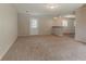 Large living room features neutral carpeting and access to backyard at 2783 Bicentennial Dr, Stone Mountain, GA 30087