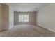 Spacious living room with neutral carpeting and ample natural light at 2783 Bicentennial Dr, Stone Mountain, GA 30087