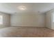 Bright living room with plush carpeting and a large window at 2783 Bicentennial Dr, Stone Mountain, GA 30087