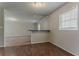 Open-concept living room features hardwood floors and a stylish bar area at 2783 Bicentennial Dr, Stone Mountain, GA 30087