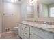 Bathroom featuring double sinks with white cabinets and granite countertops at 2957 Temple Johnson Rd, Snellville, GA 30039