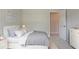 Well-lit bedroom with neutral walls and cozy decor at 2957 Temple Johnson Rd, Snellville, GA 30039