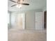 A neutral bedroom with a ceiling fan and access to the bathroom at 2957 Temple Johnson Rd, Snellville, GA 30039