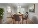 Cozy dining room with natural light and stylish furnishings, adjacent to kitchen at 2957 Temple Johnson Rd, Snellville, GA 30039