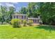 Charming two-story home with well-maintained lawn and mature trees at 2957 Temple Johnson Rd, Snellville, GA 30039