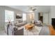 Bright living room featuring neutral decor, large windows, and a ceiling fan at 2957 Temple Johnson Rd, Snellville, GA 30039