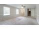 Spacious living room with plenty of natural light, stairs, and access to the front door at 2957 Temple Johnson Rd, Snellville, GA 30039