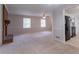 Open concept living area featuring a brick fireplace and access to the kitchen at 2957 Temple Johnson Rd, Snellville, GA 30039