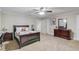 Comfortable bedroom with carpet, ceiling fan, and space to relax at 5040 Fawn Valley Dr, Loganville, GA 30052