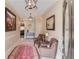 Grand foyer featuring elegant lighting fixtures, seating, a decorative rug, and views into other rooms at 5040 Fawn Valley Dr, Loganville, GA 30052
