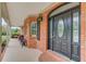 Close-up of the elegant front door, set within a brick facade and a cozy covered porch at 5040 Fawn Valley Dr, Loganville, GA 30052