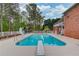 Backyard pool with a diving board, slide, and gazebo, offering a great space for outdoor recreation and relaxation at 5040 Fawn Valley Dr, Loganville, GA 30052