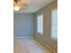 This bedroom features grey walls, ceiling fan, and bright natural light at 130 Mimosa Dr, Fayetteville, GA 30214