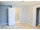 Neutral bedroom with white doors and trim and tile flooring at 130 Mimosa Dr, Fayetteville, GA 30214