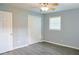 Cozy bedroom featuring a ceiling fan, light blue walls, and modern wood-look flooring at 130 Mimosa Dr, Fayetteville, GA 30214