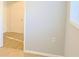 Hallway entrance featuring beige tile flooring and leading to a bright room at 130 Mimosa Dr, Fayetteville, GA 30214