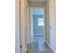 Bright hallway with wood floors leading to a bedroom at 130 Mimosa Dr, Fayetteville, GA 30214
