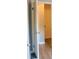 Hallway featuring modern flooring, with doorways to adjacent rooms at 130 Mimosa Dr, Fayetteville, GA 30214