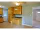 Cozy kitchen features tile floors, wood cabinets, and modern ceiling fan at 130 Mimosa Dr, Fayetteville, GA 30214