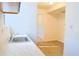 This is a simple kitchenette that overlooks another room with laminate flooring at 130 Mimosa Dr, Fayetteville, GA 30214