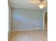 Living room with light wood flooring, light grey walls and modern ceiling fan at 130 Mimosa Dr, Fayetteville, GA 30214