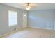 Bright living room with light hardwood flooring, neutral walls, and ceiling fan at 130 Mimosa Dr, Fayetteville, GA 30214