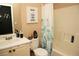 Bathroom with a tub, shower curtain, and vanity at 1473 Wildwood Way, Hampton, GA 30228
